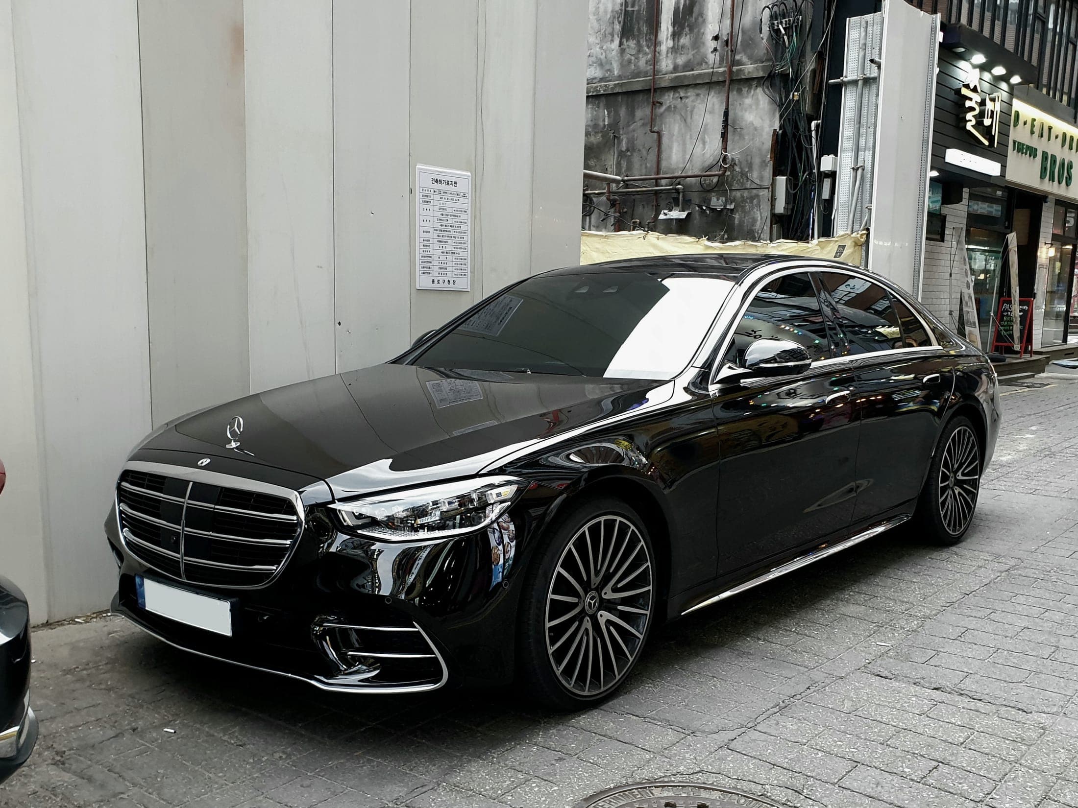 A black premium sedan, representative of the private transfer vehicles used for airport and hotel pickups