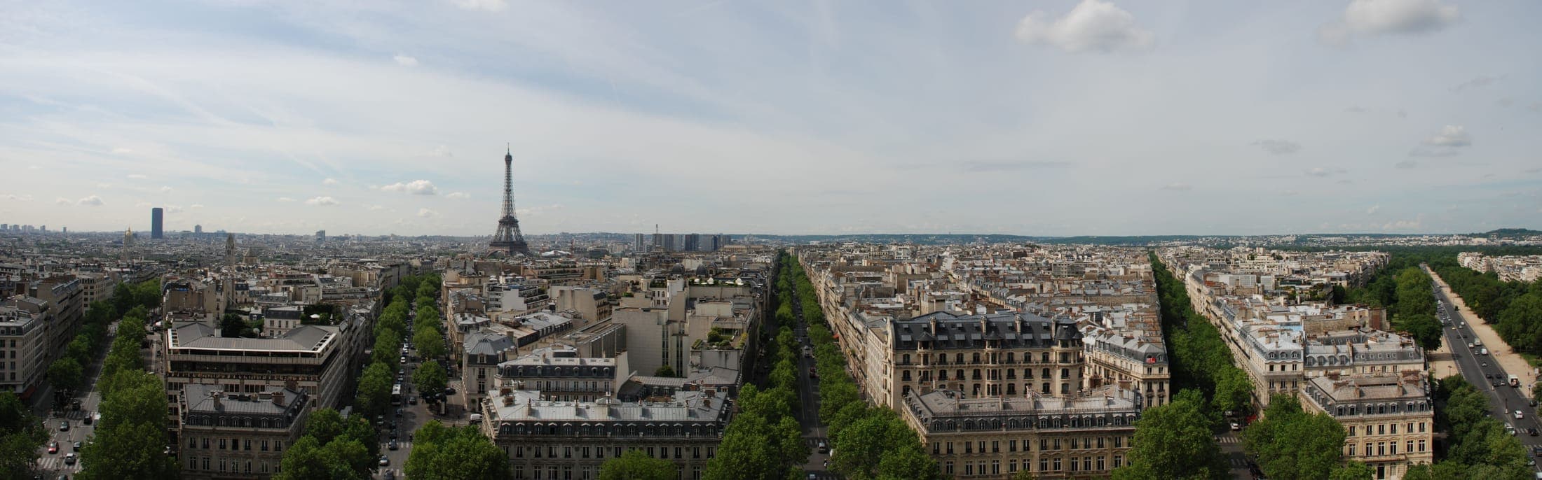 Panoramic view of the Paris skyline and the Seine from the top of the Arc de Triomphe