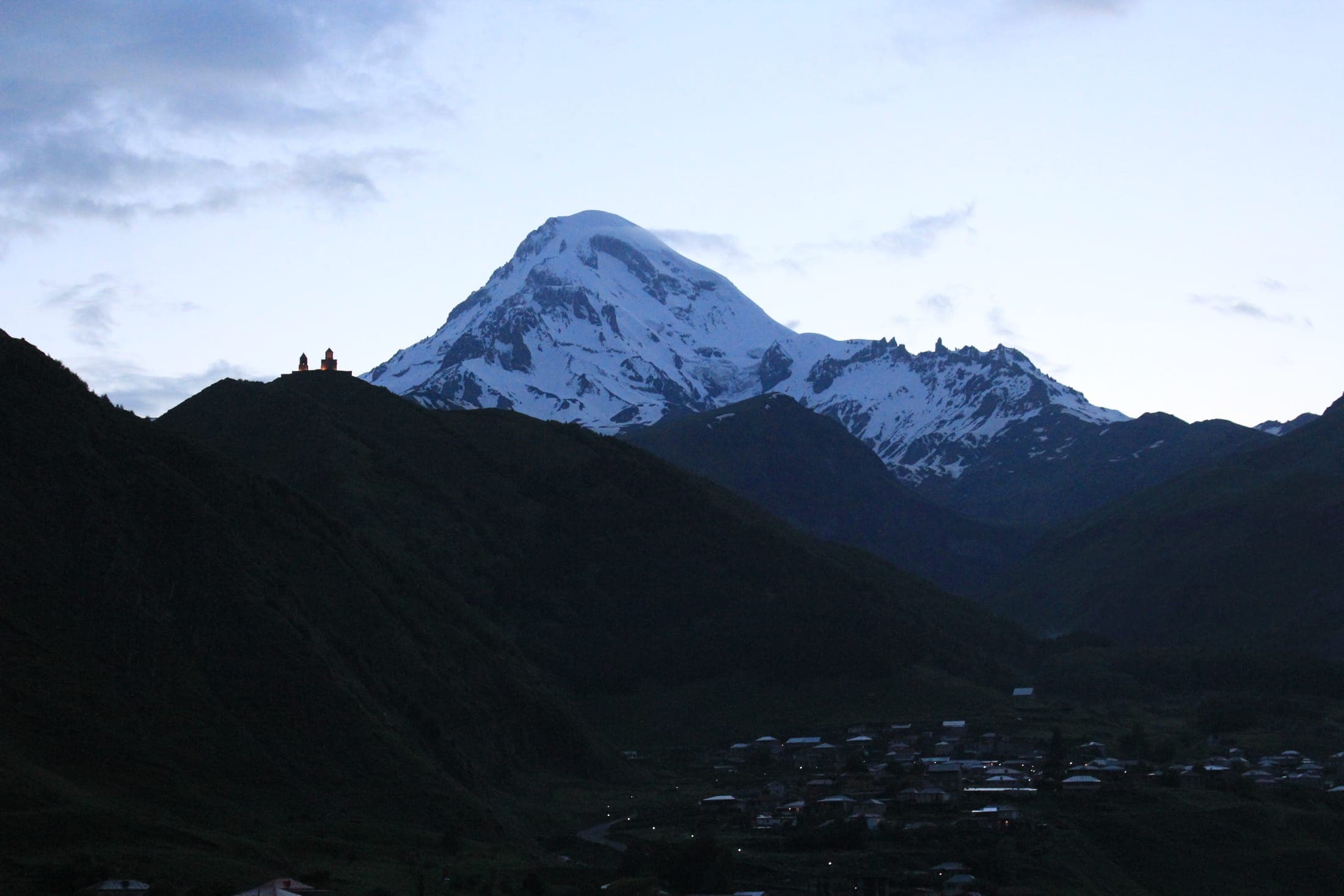 Gergeti Trinity Church with Mount Kazbek in the background, Georgia