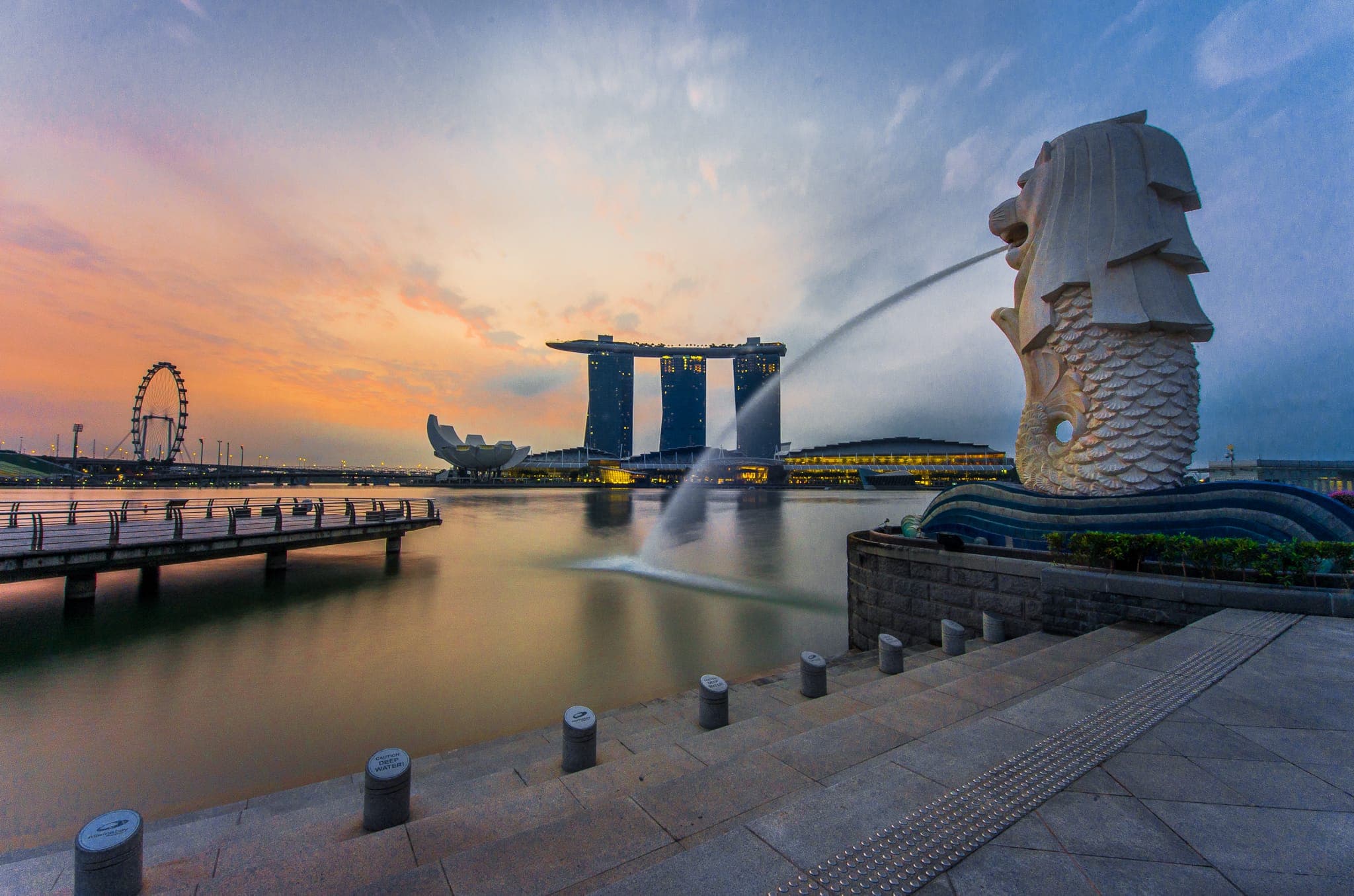 Rear view of the Merlion statue at Merlion Park with Marina Bay Sands in the background