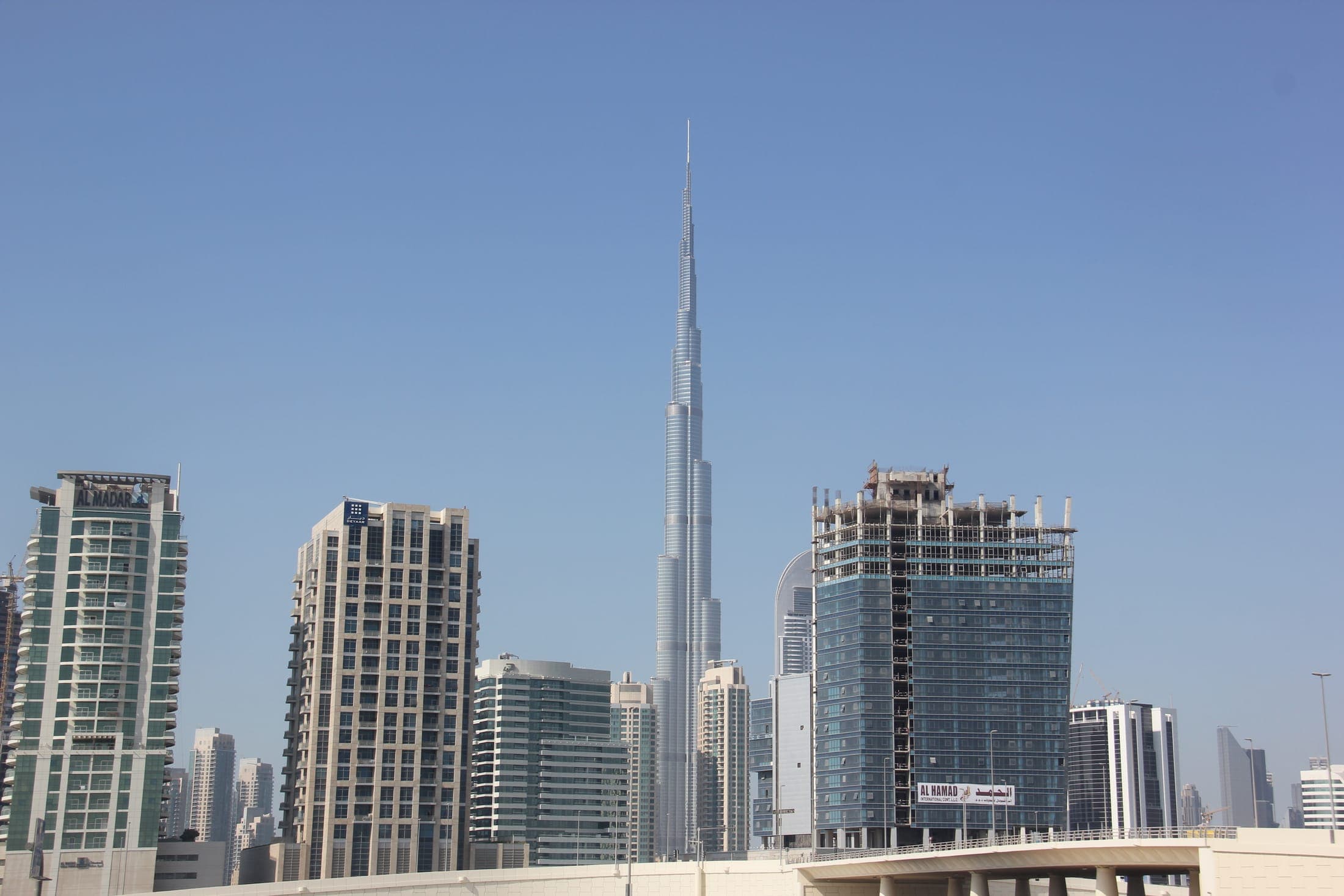Burj Khalifa tower rising above surrounding Dubai skyscrapers