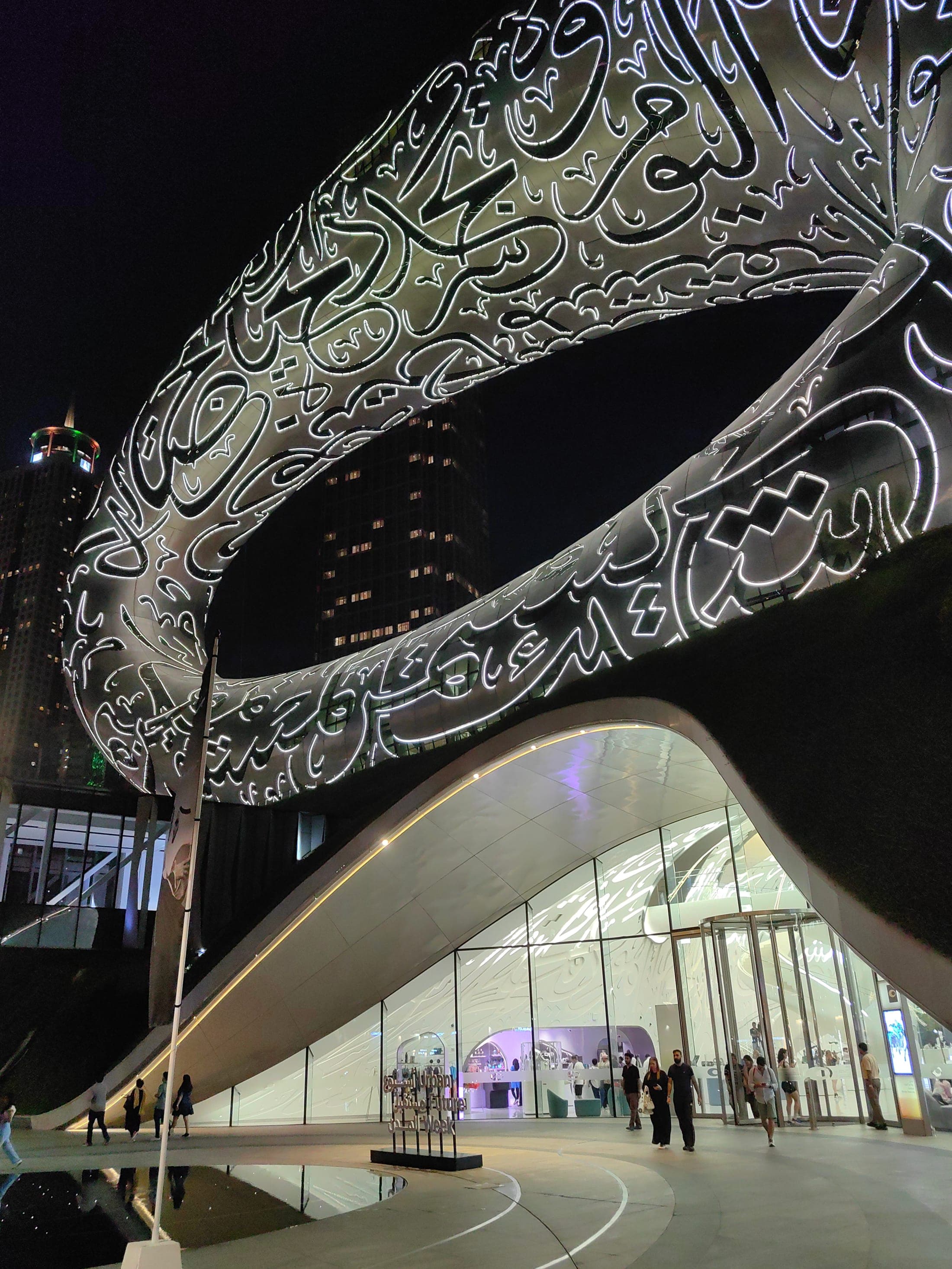 Exterior of the Museum of the Future, its torus-shaped facade inscribed with Arabic calligraphy, Dubai