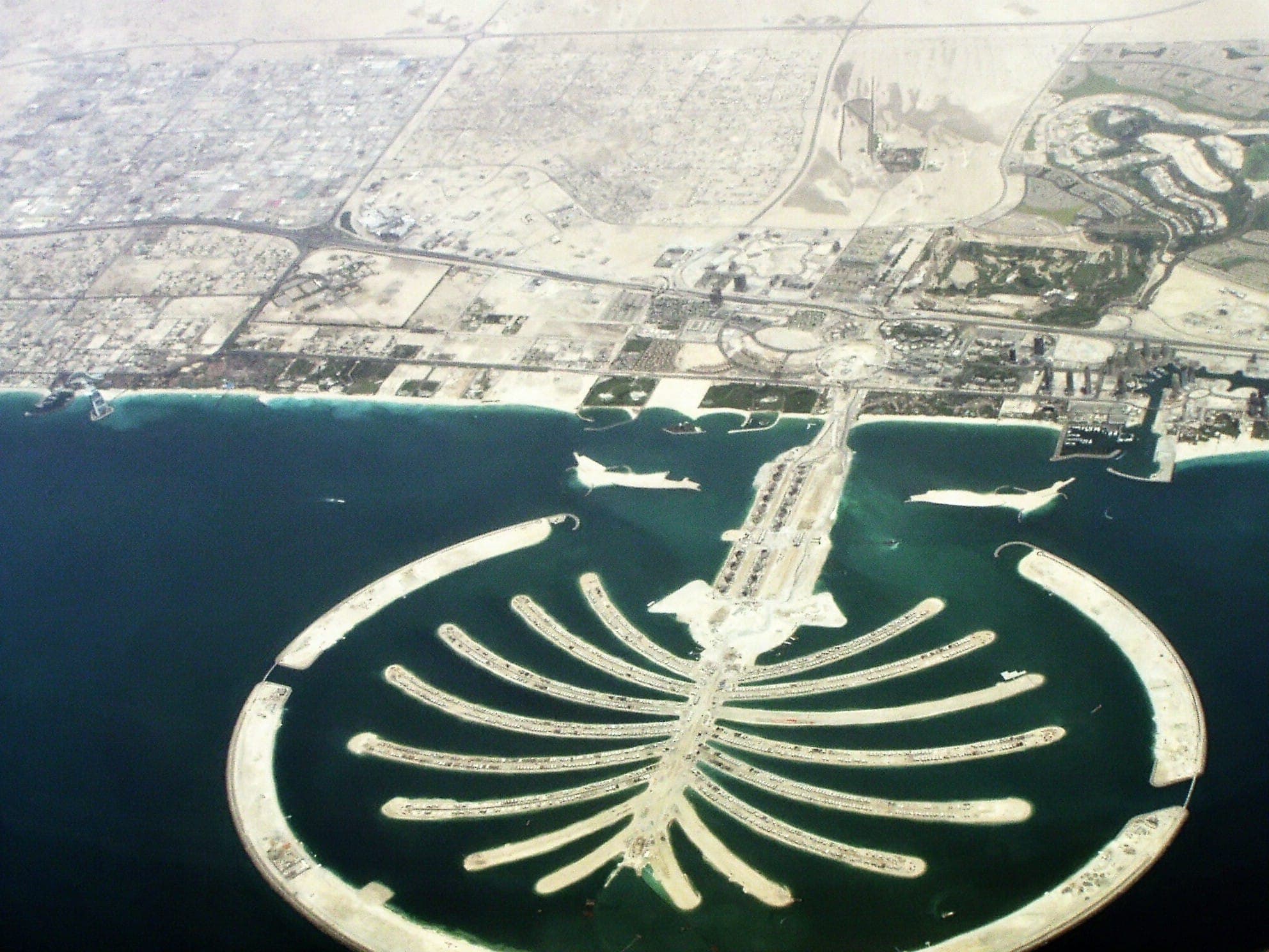 Aerial view of Palm Jumeirah's palm-tree-shaped island development in the sea off Dubai